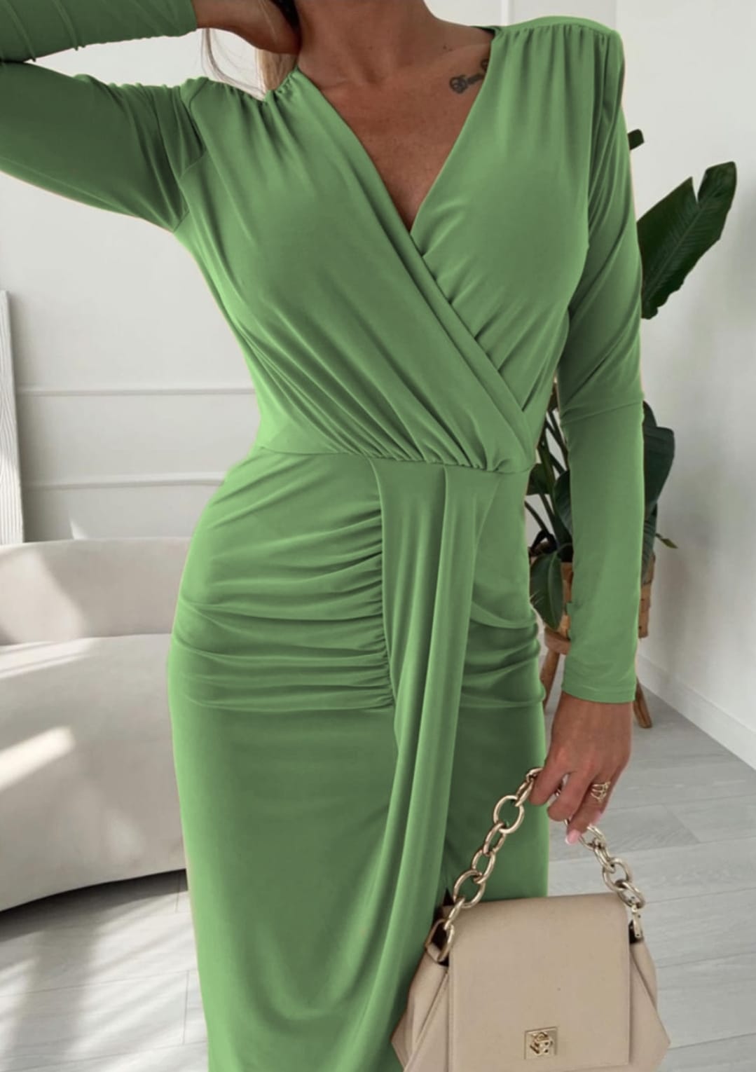 
                  
                    Seanson dress with envelope neckline and seductive slit
                  
                