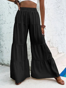 I Pantaloni a Gamba Larga con Orlo Arricciato sono Perfetti Per un Look Estivo e Rilassato - Regina Store By Centparadise